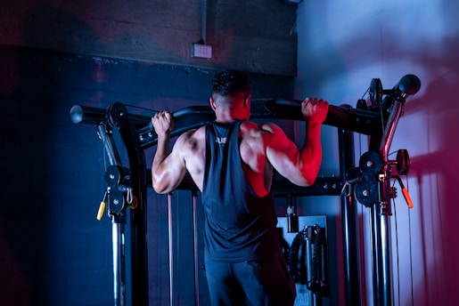 A man doing a pull up on a pull up bar