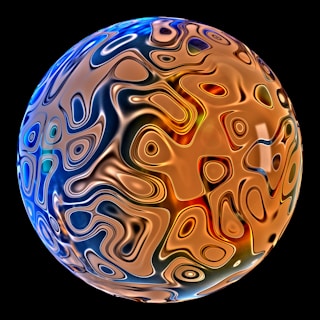 A colorful glass ball on a black background
