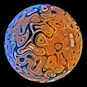 A colorful glass ball on a black background