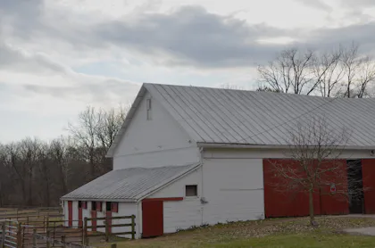 Large red and white barn on a farm