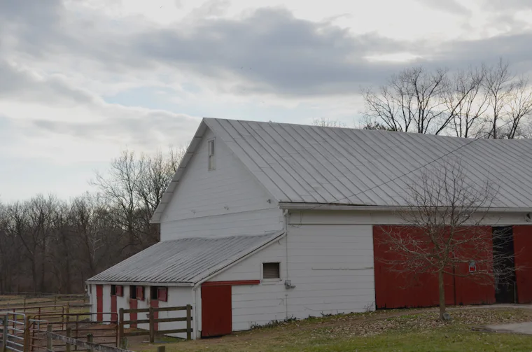 Large red and white barn on a farm