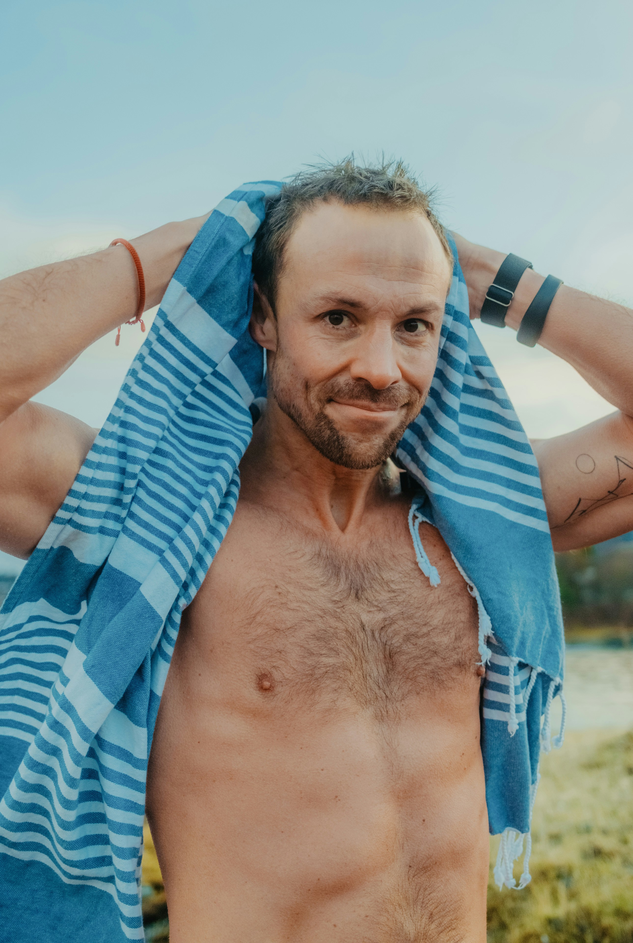 A man with a towel around his neck