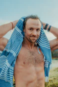 A man with a towel around his neck