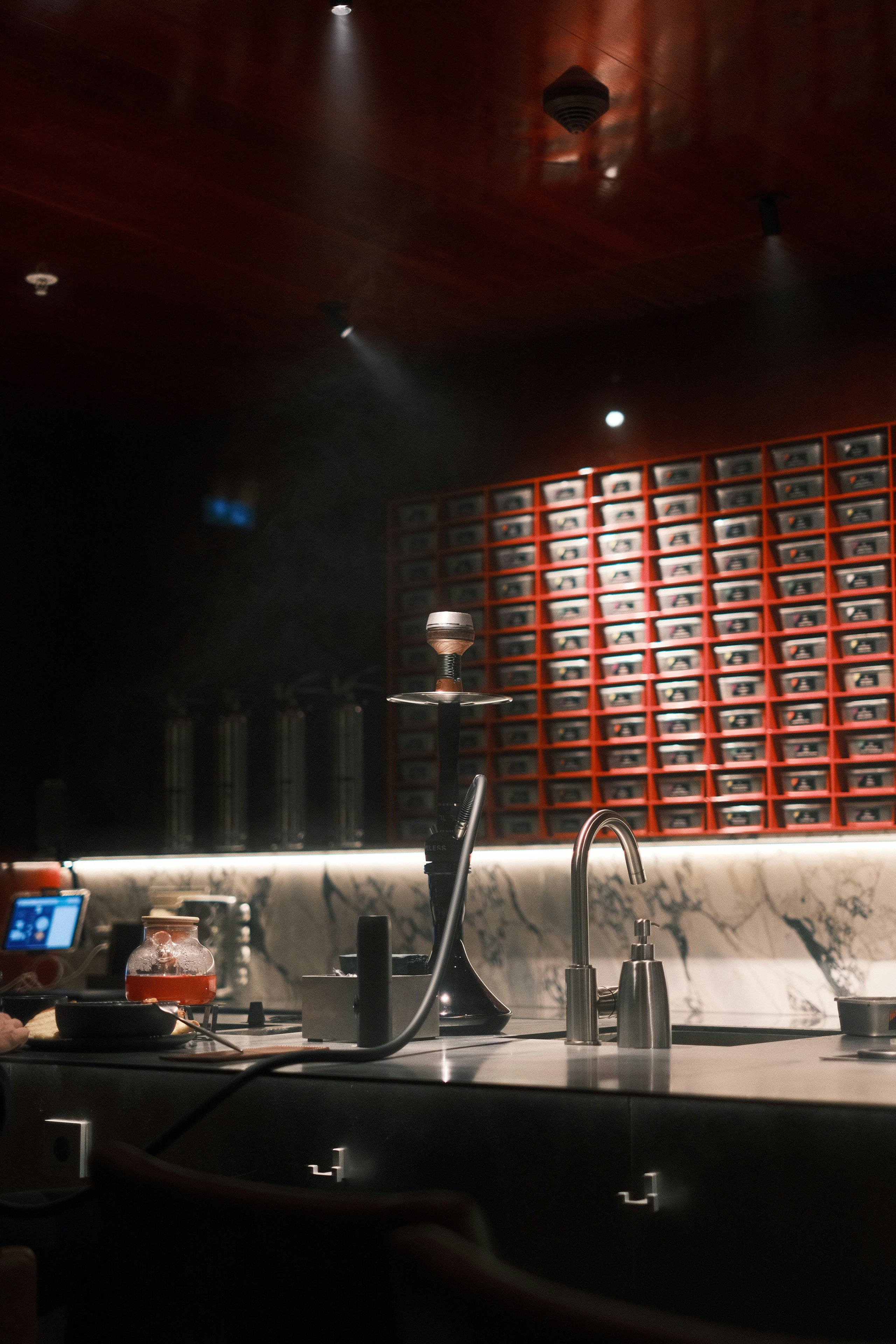 Warmly lit discreet display shelves inside the Smoke Eat adult store