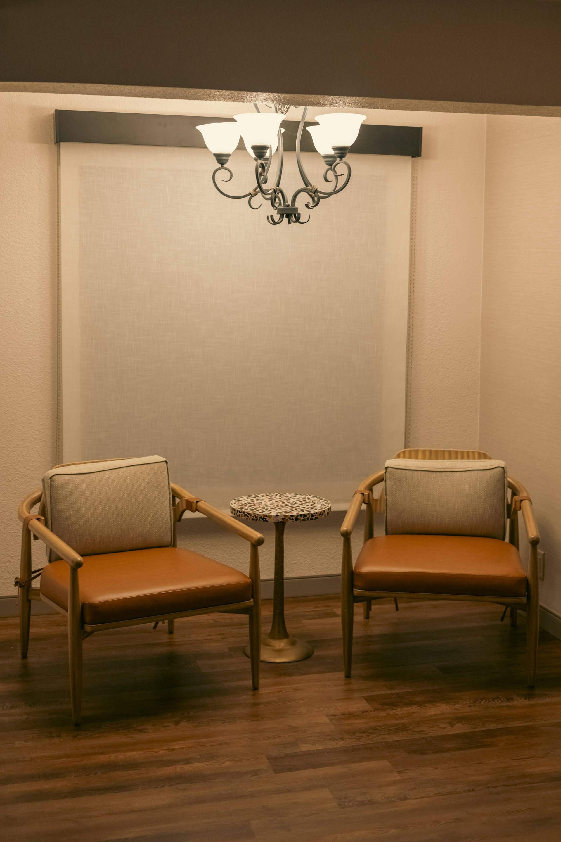 Two chairs and a table in a room