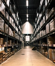 A warehouse filled with lots of shelves filled with boxes
