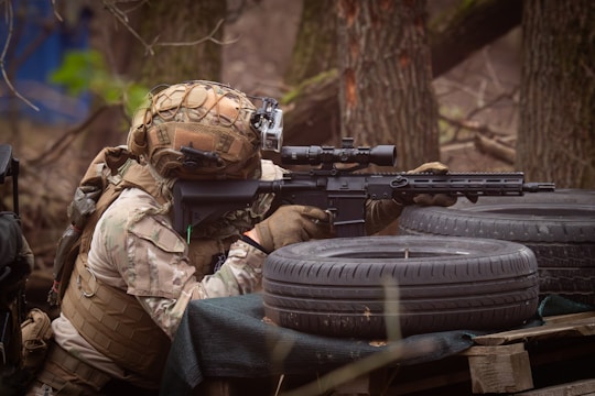 A man with a gun and a rifle