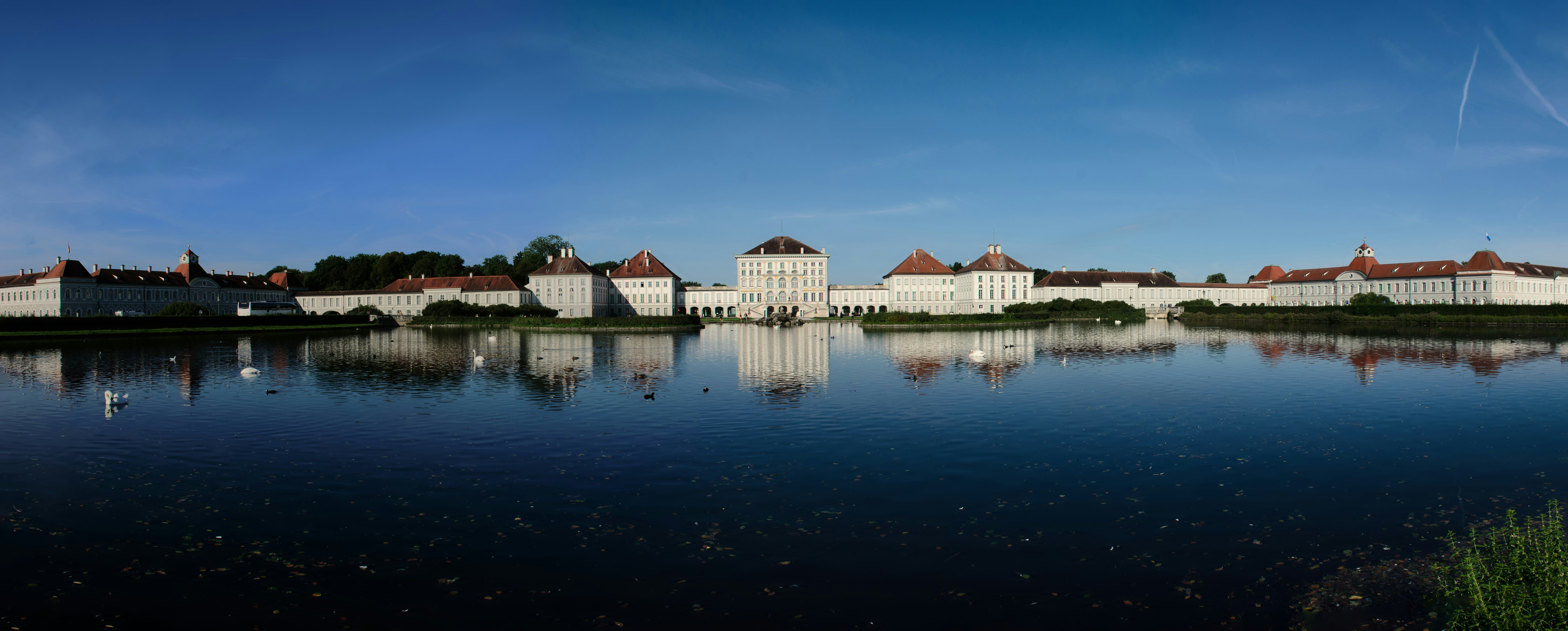 A large body of water with buildings in the background