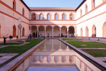 A large building with a pool in the middle of it