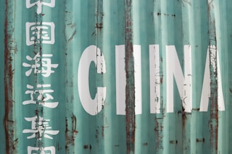 A close up of a metal container with writing on it