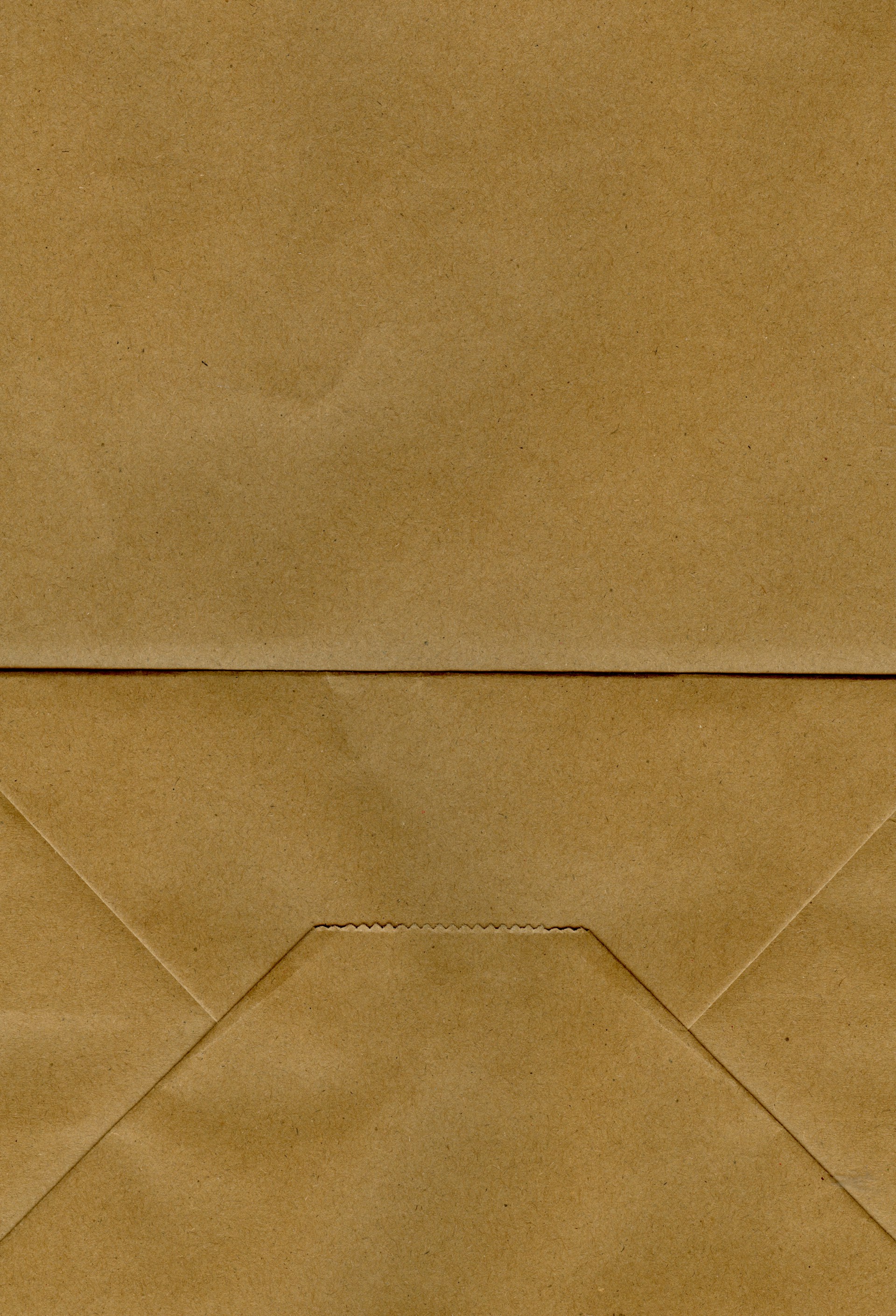 A close up of a brown envelope with a piece of paper sticking out of it