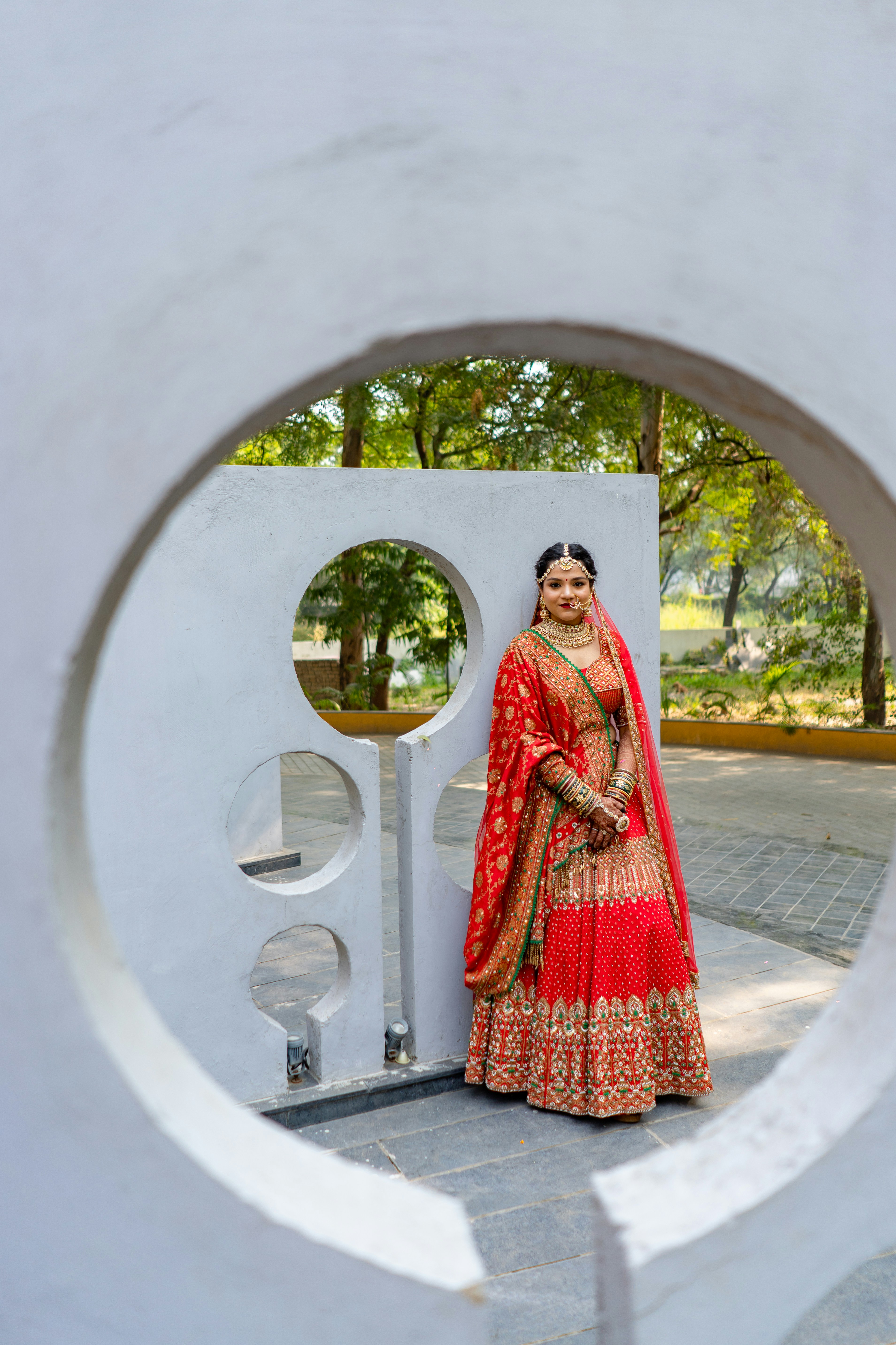 A woman standing in front of a sculpture