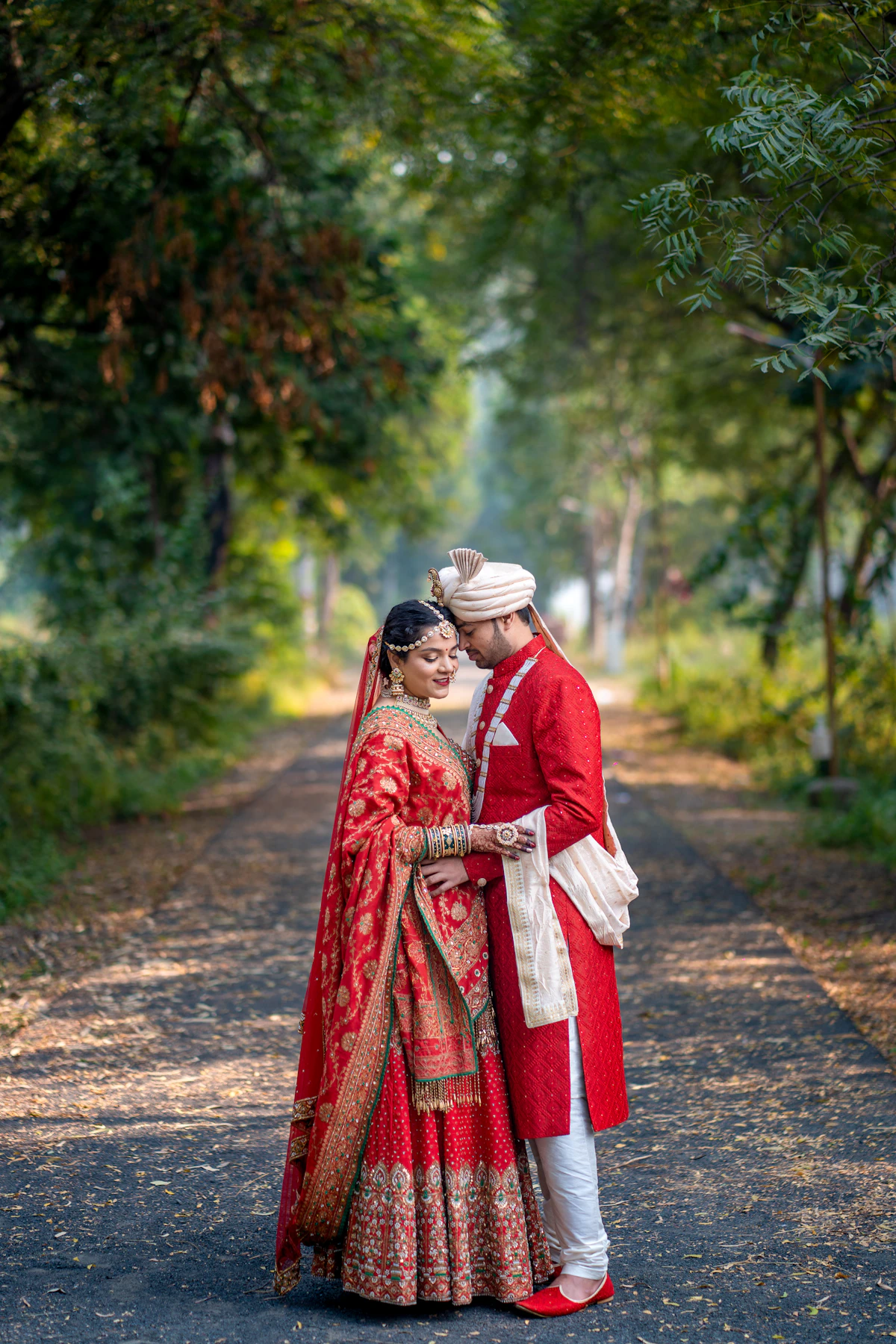Couple on a wooded path during a pre-wedding shoot in Delhi NCR