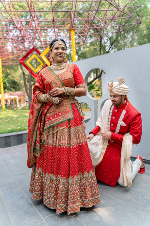 A man and a woman dressed in indian attire