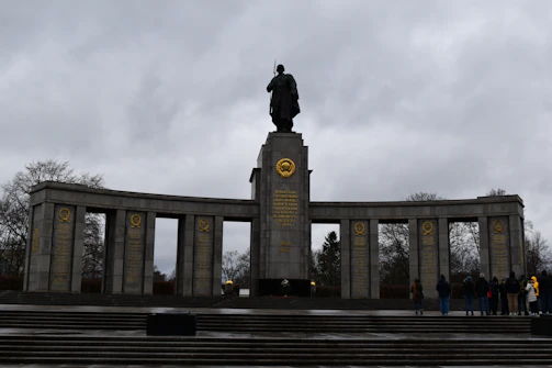 A monument with a statue of a man on top of it