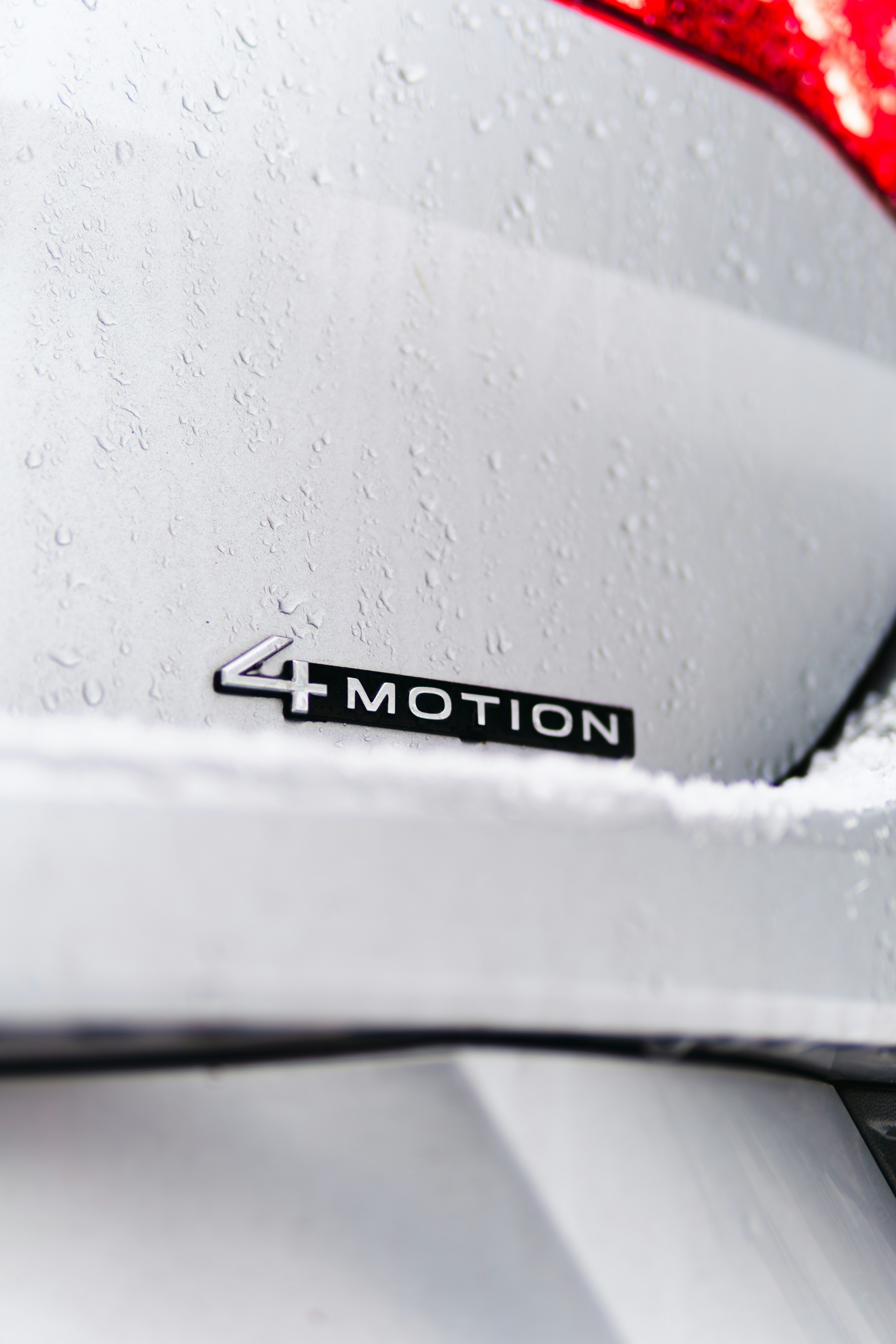 A close up of the rear end of a white car