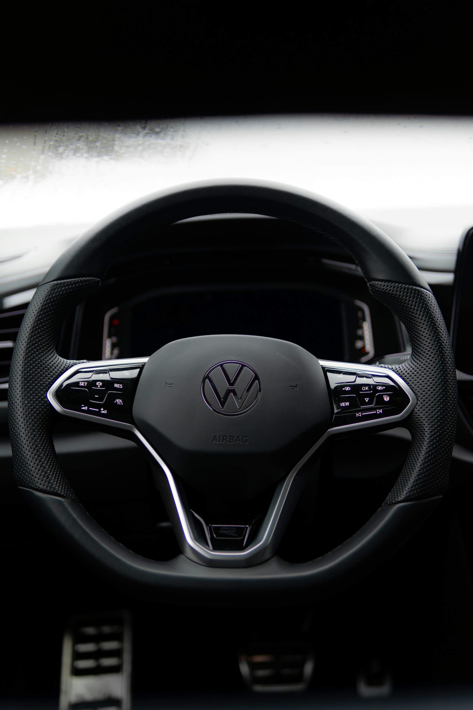 A steering wheel and dashboard of a car