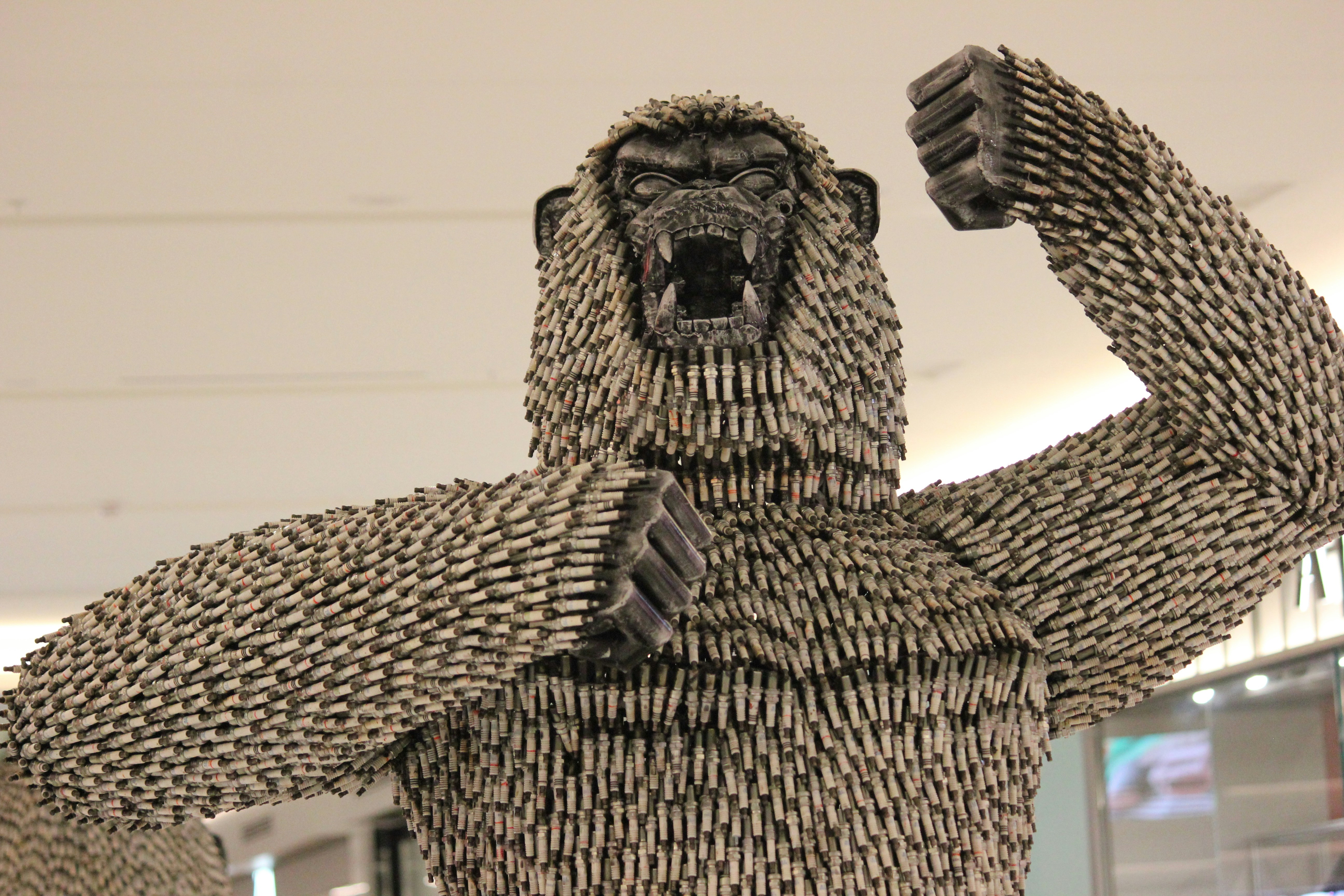 A sculpture of a man with a gorilla face