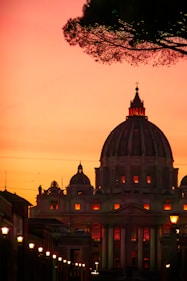 The dome of a building is lit up at night