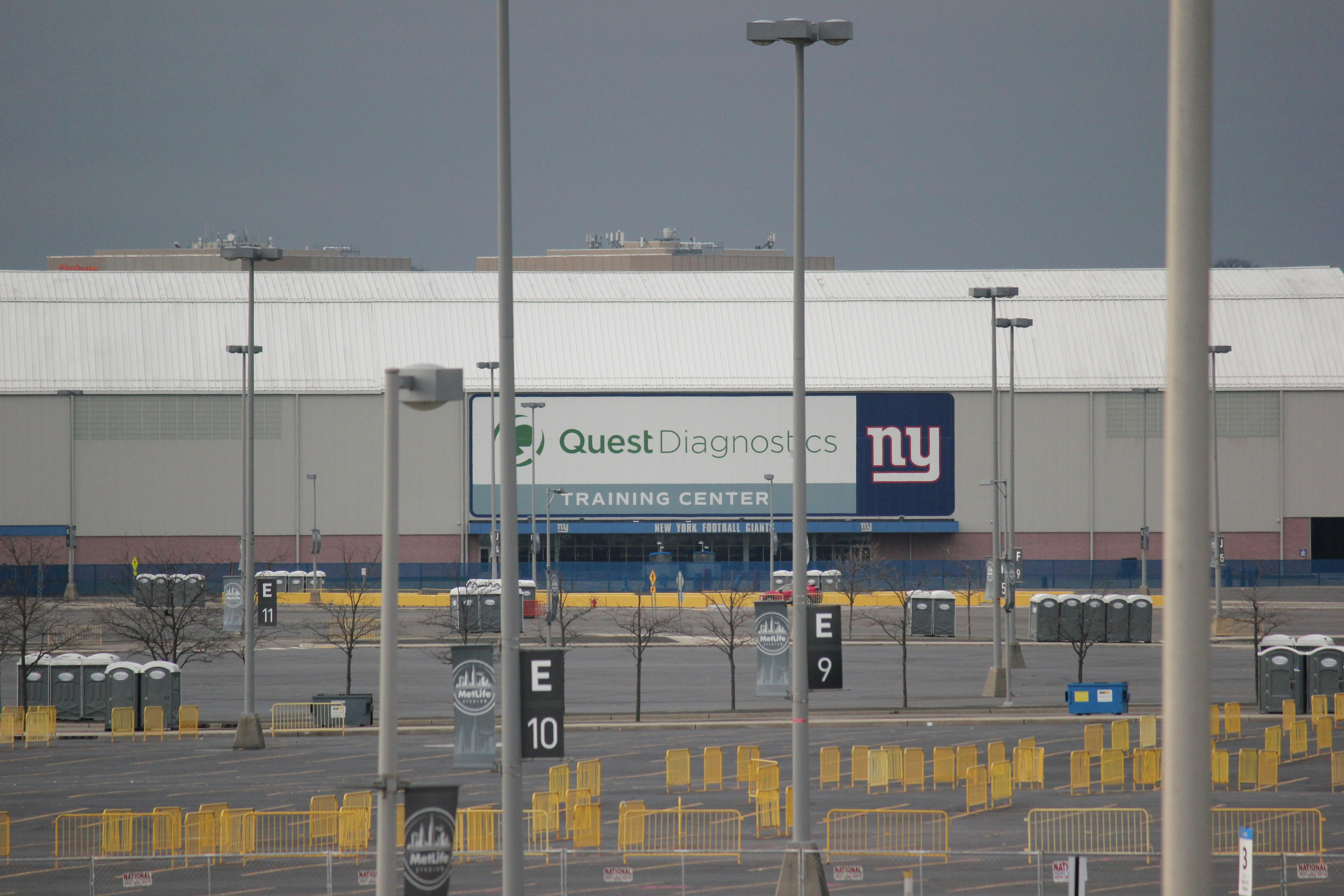 A parking lot with a building in the background