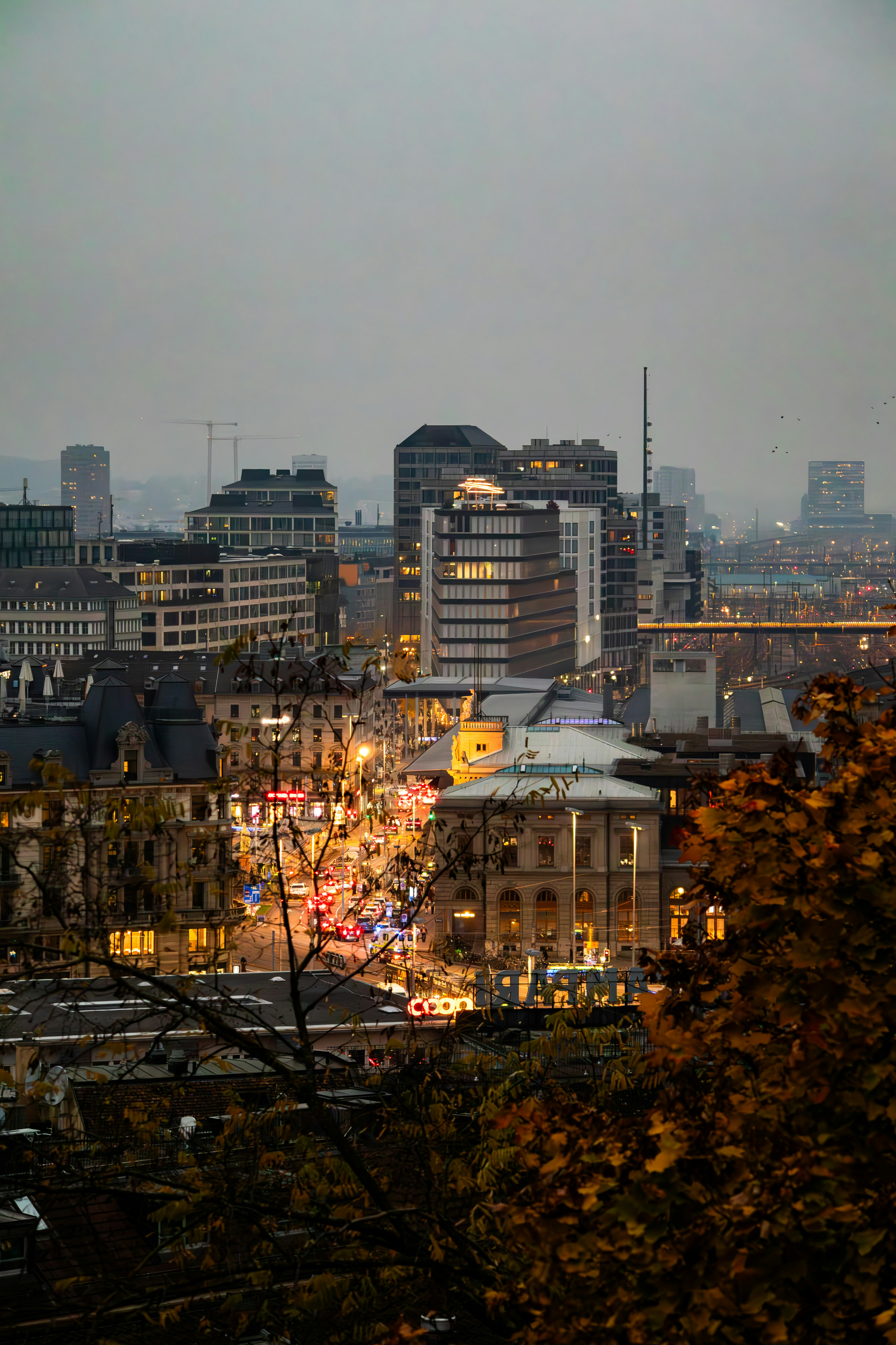 A view of a city at night from the top of a hill photo – Free Car Image ...