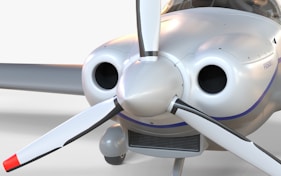A close up of a small propeller plane