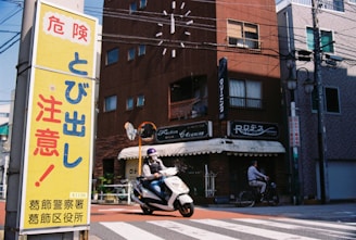 A motor scooter is parked in front of a building