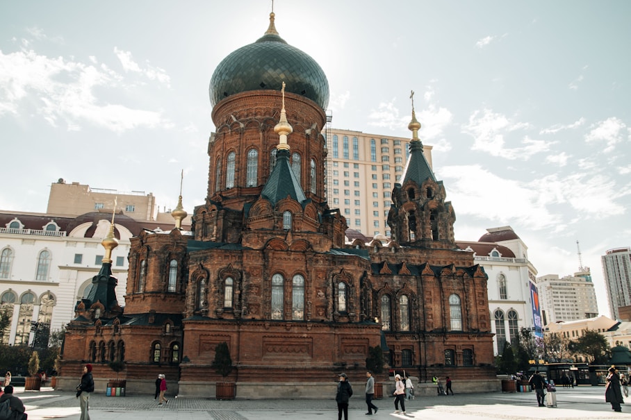 A large building with a green dome on top of it