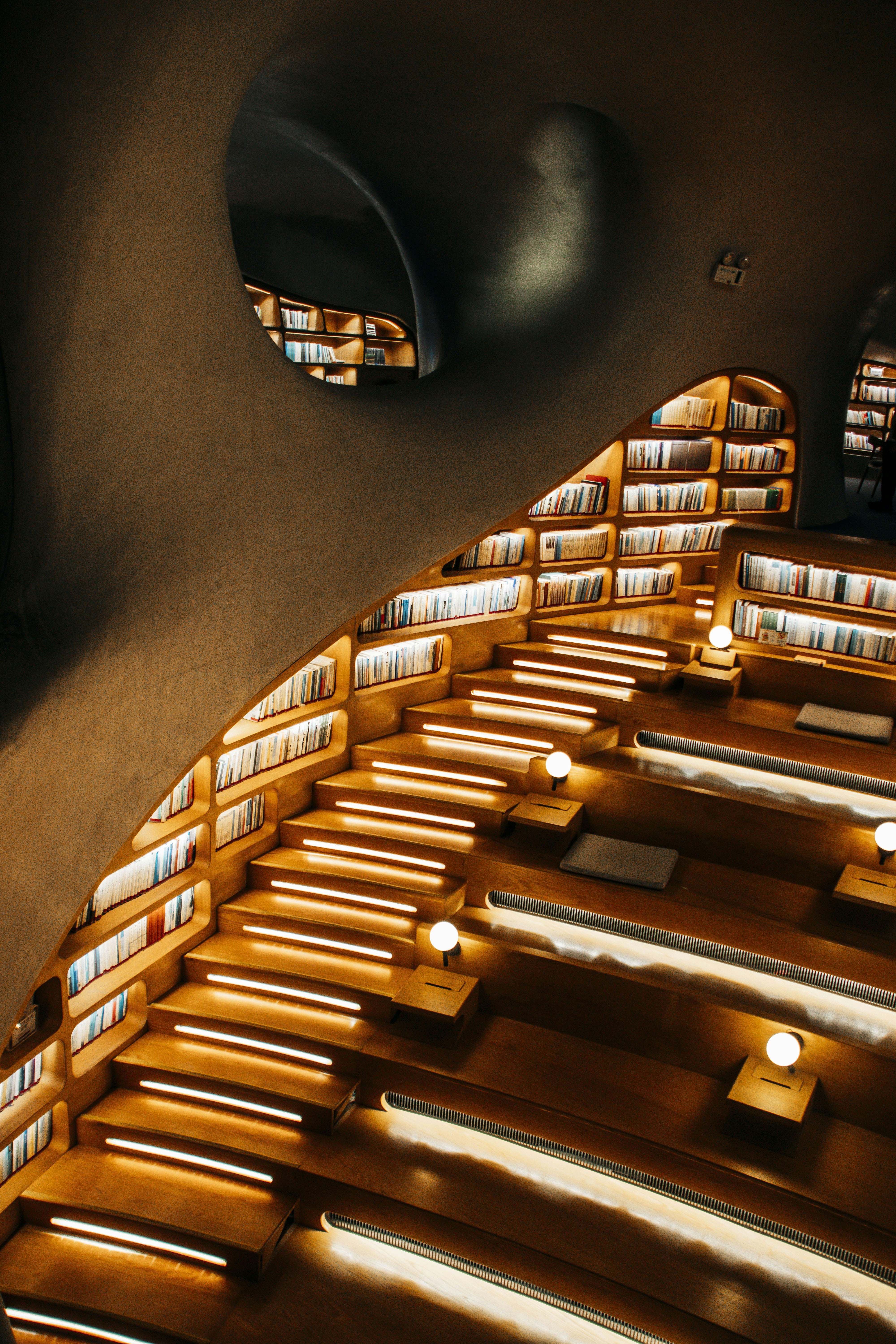 A room with a lot of books on the shelves