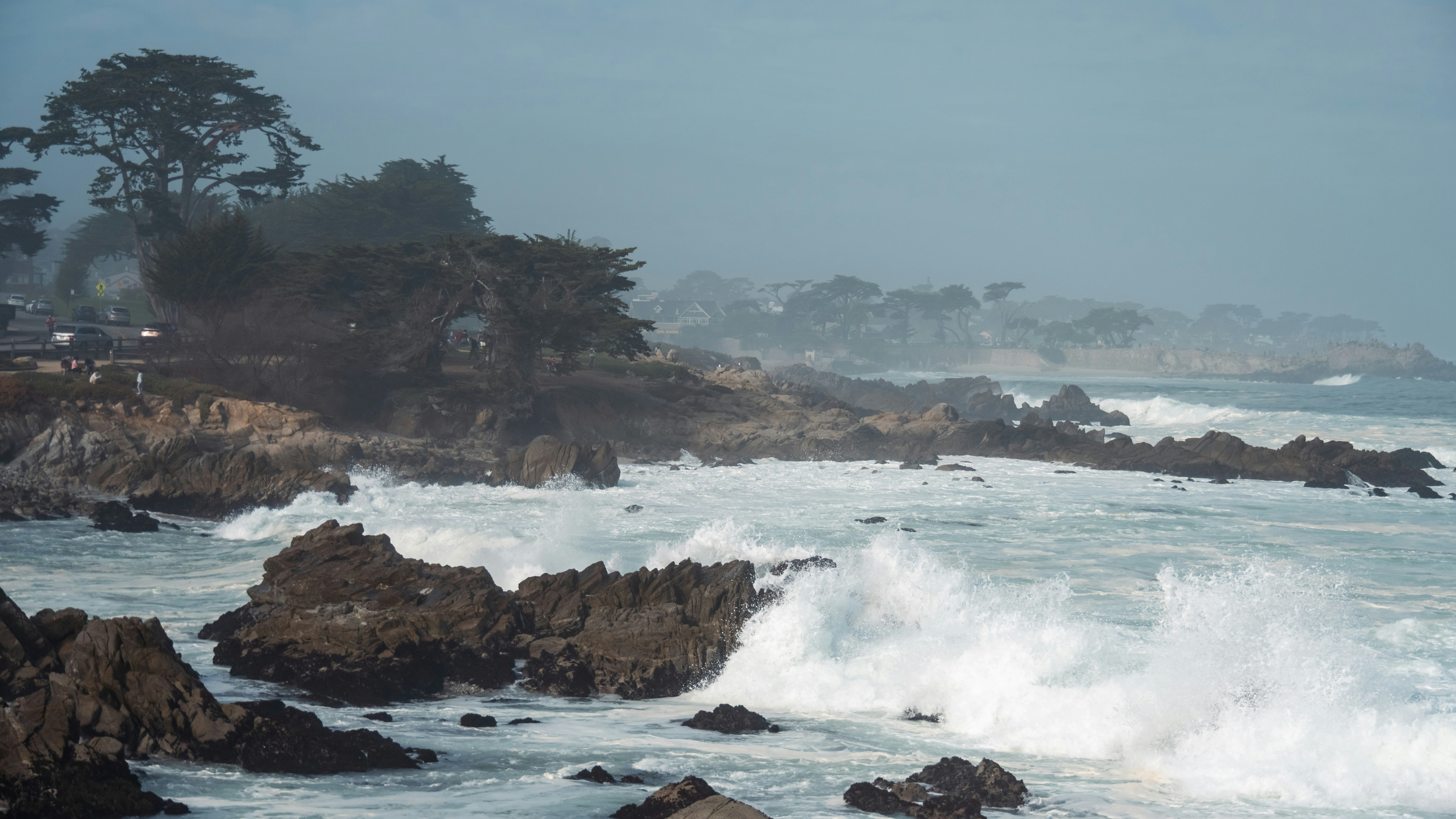 A large body of water surrounded by rocks