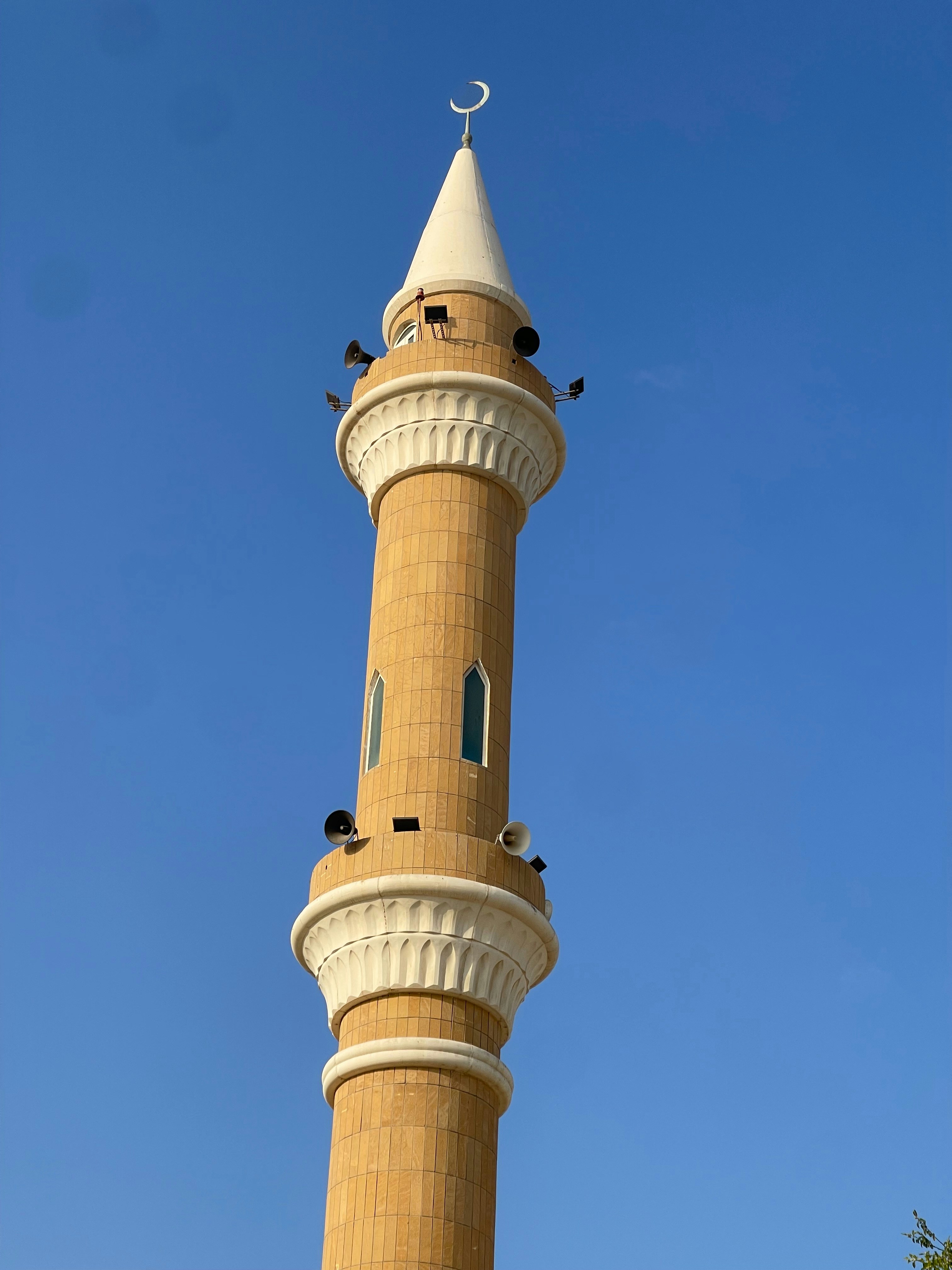 A tall tower with a clock on top of it