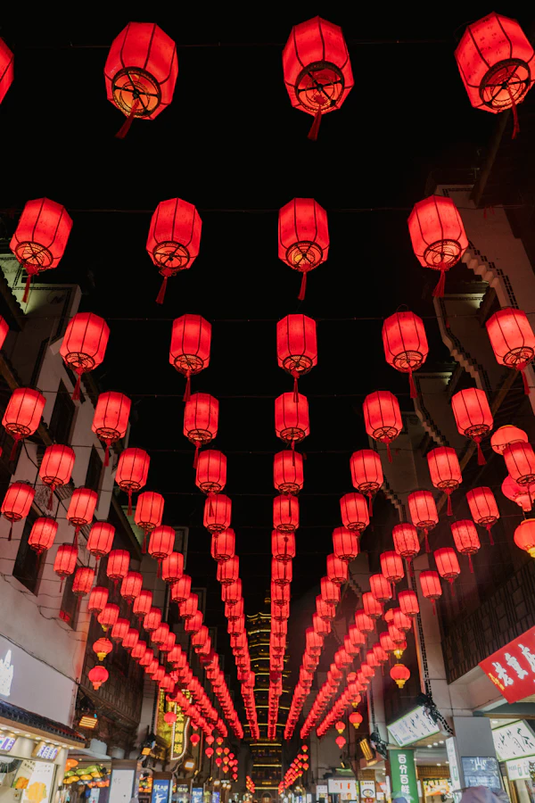 A street lined with red lanterns in China at night