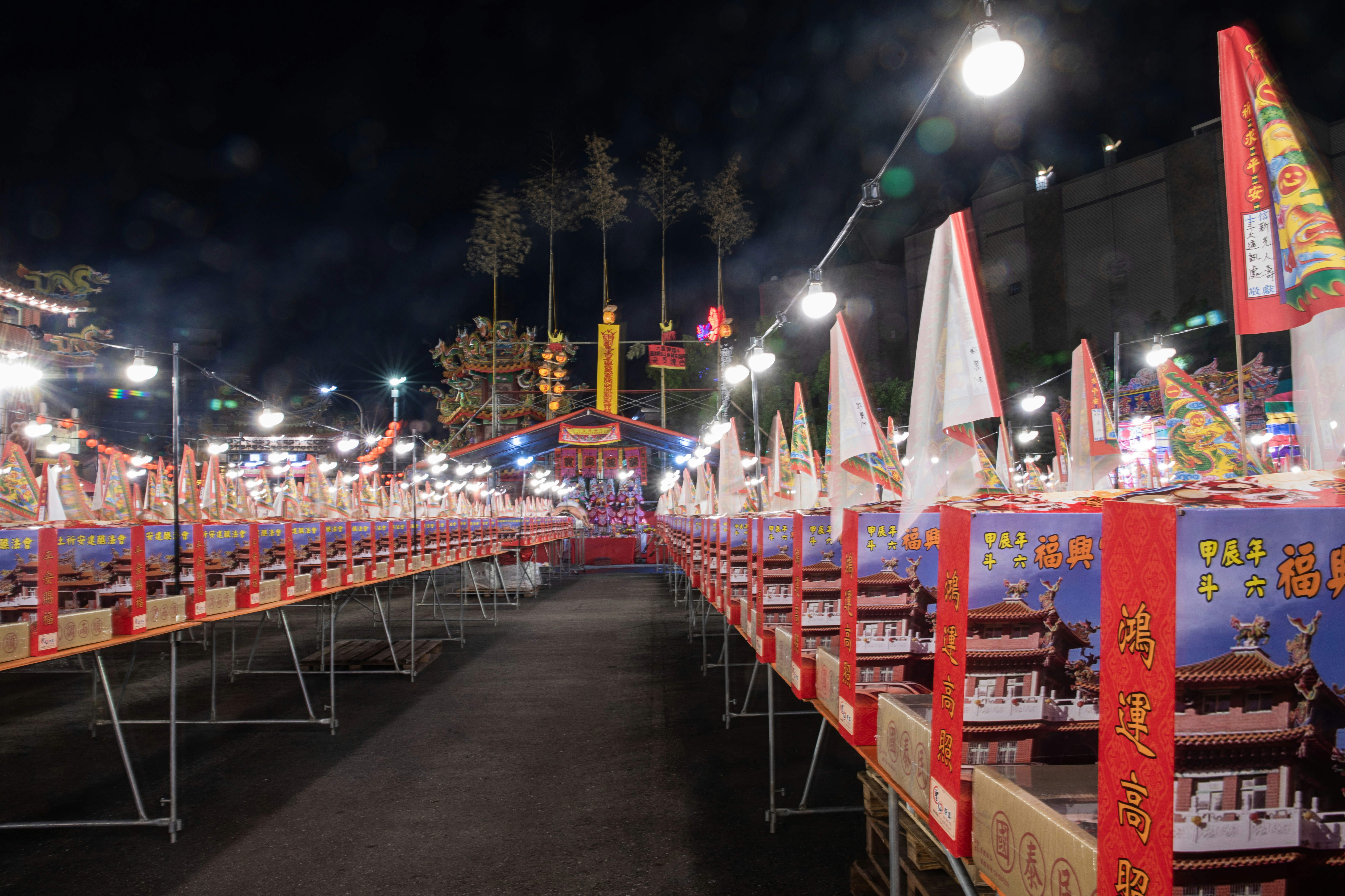 A row of tables with umbrellas on top of them