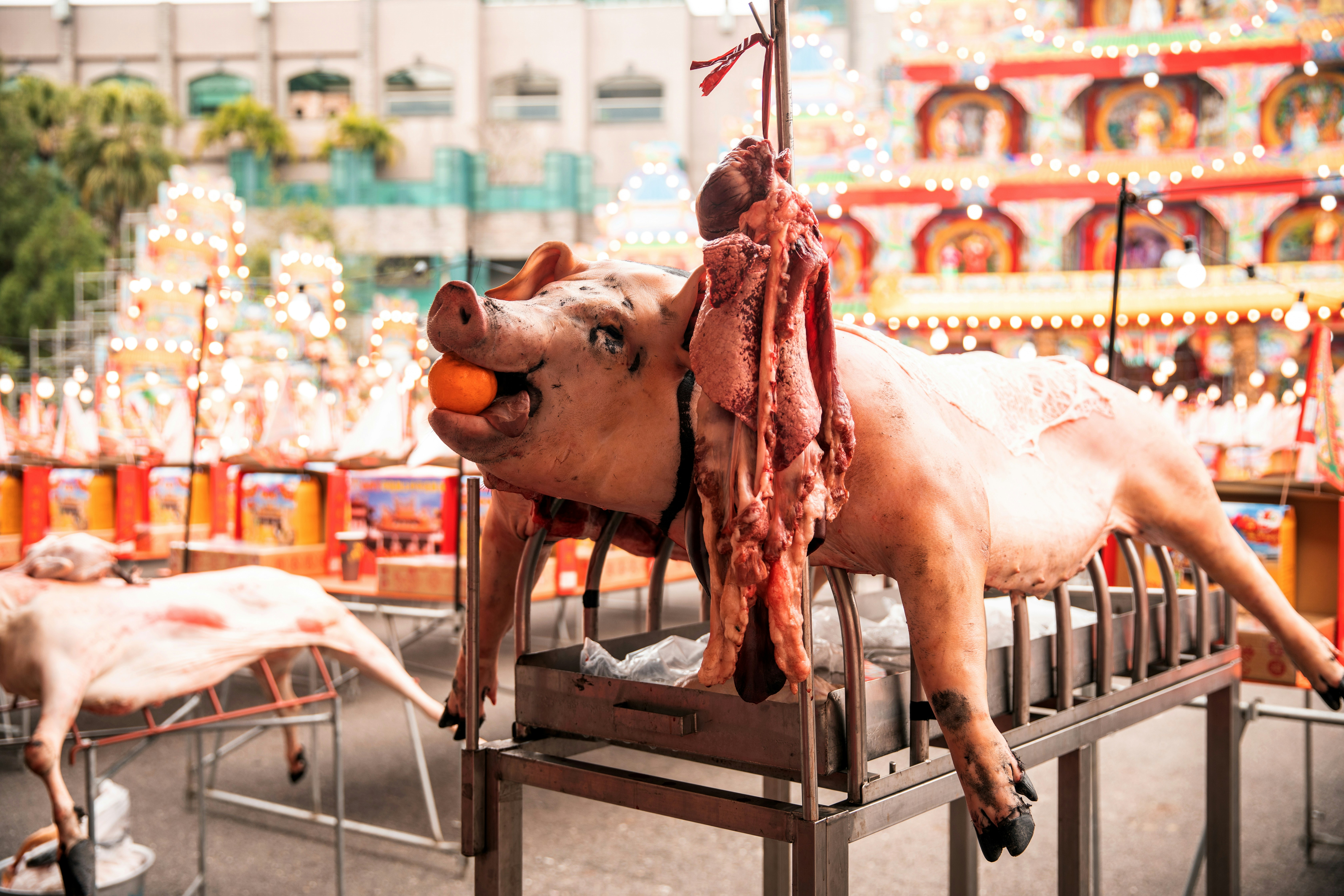 A statue of a man riding an elephant on a carousel