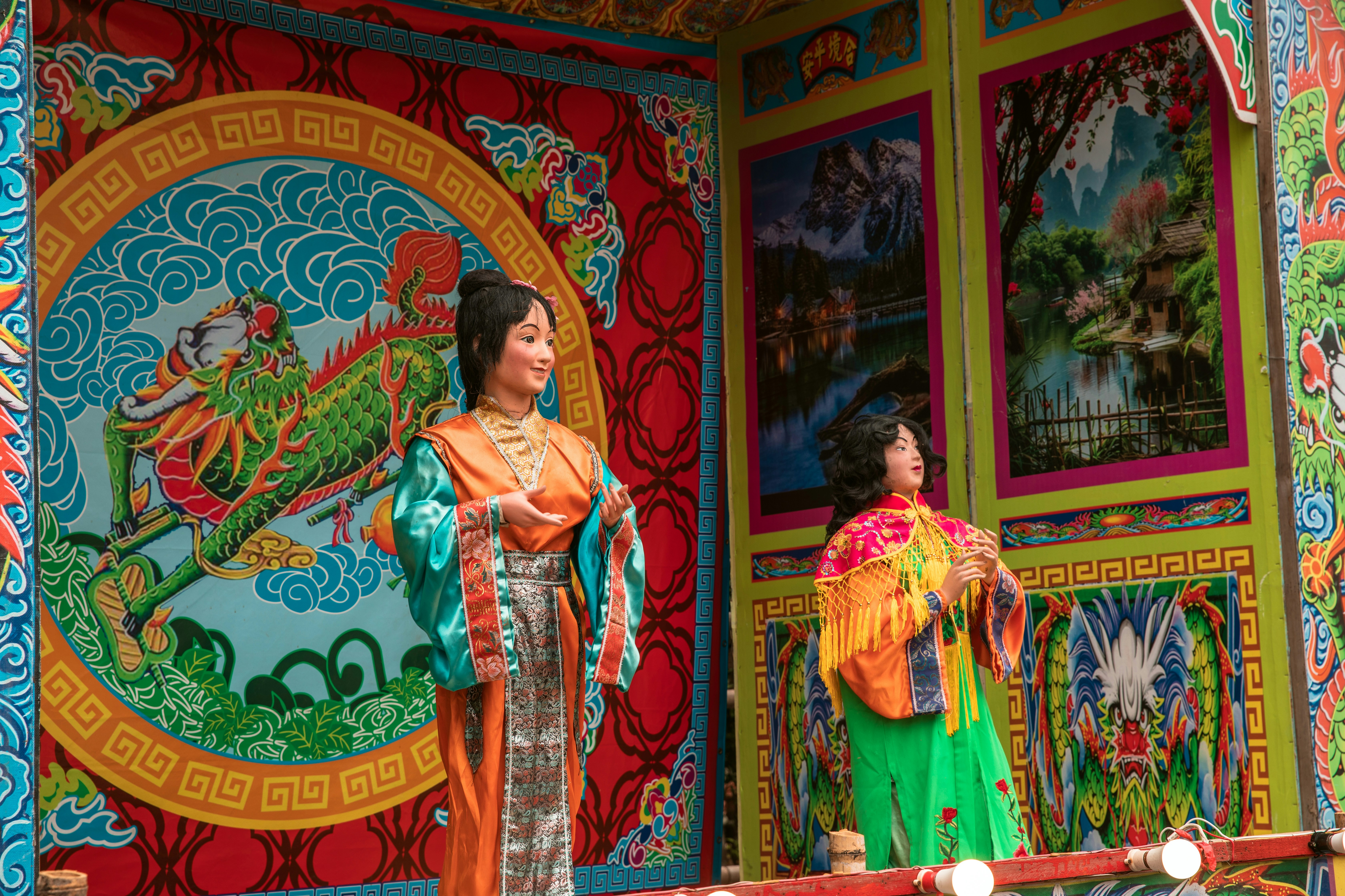 A couple of people that are standing in front of a building