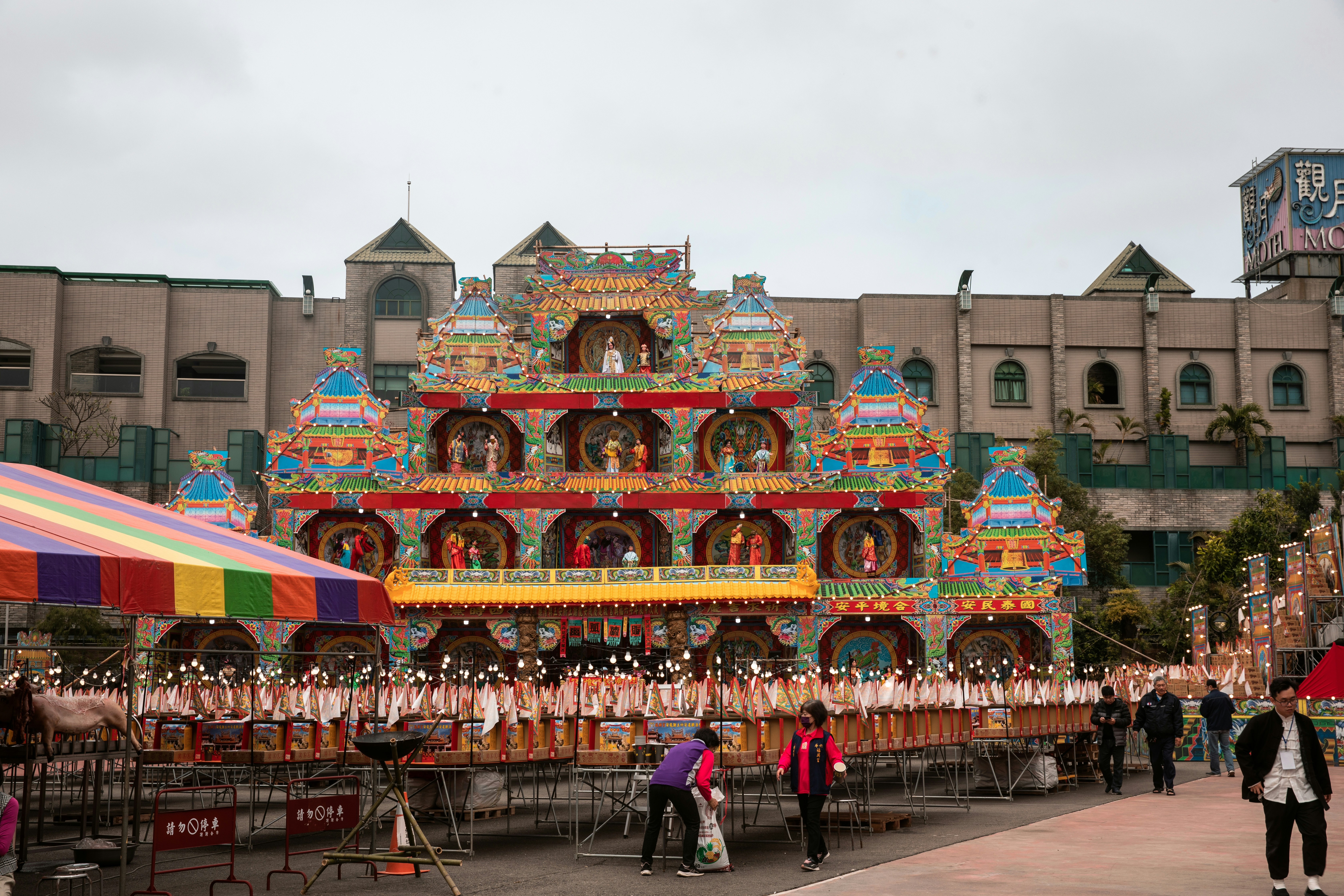 A group of people standing in front of a building