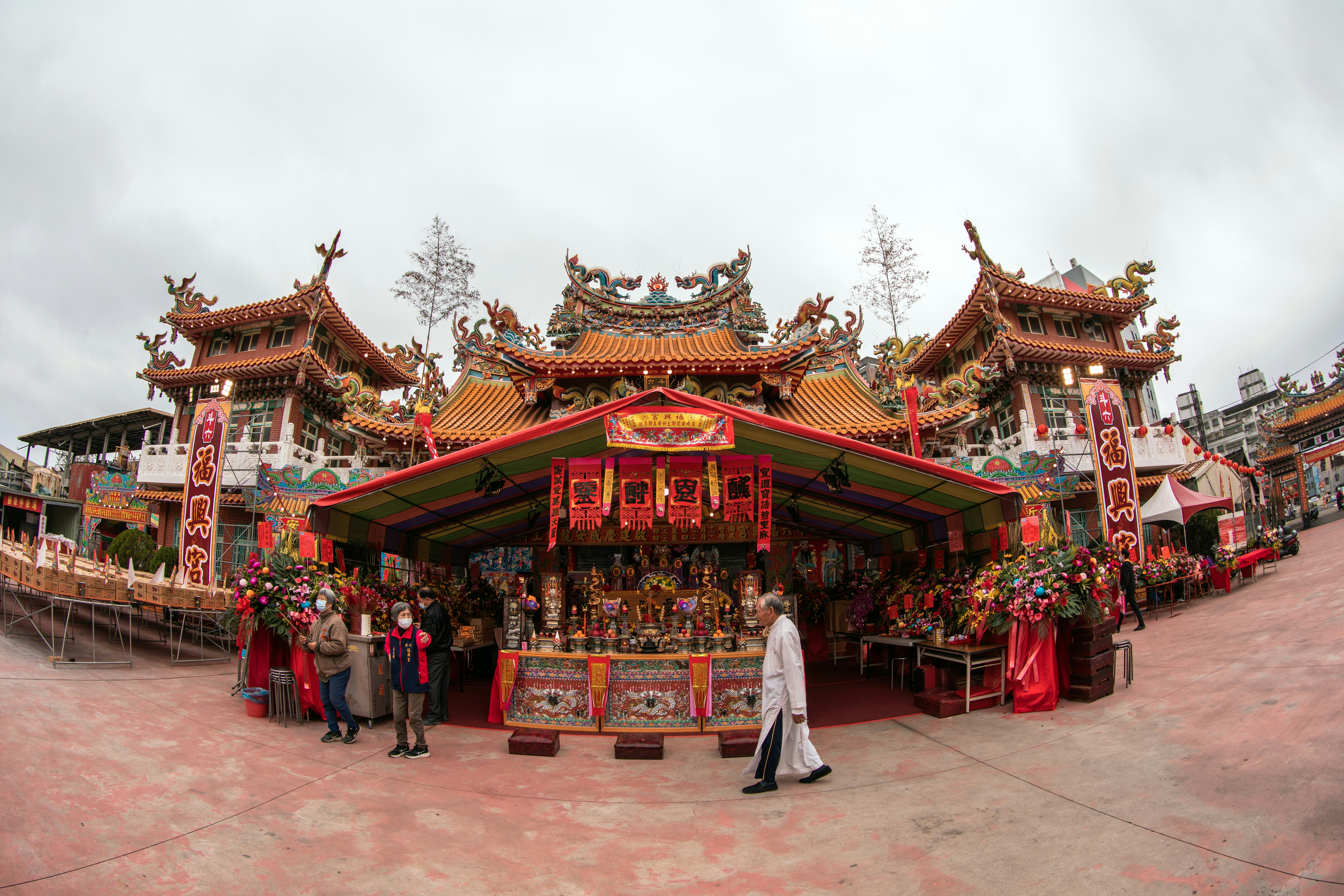 A group of people standing in front of a building