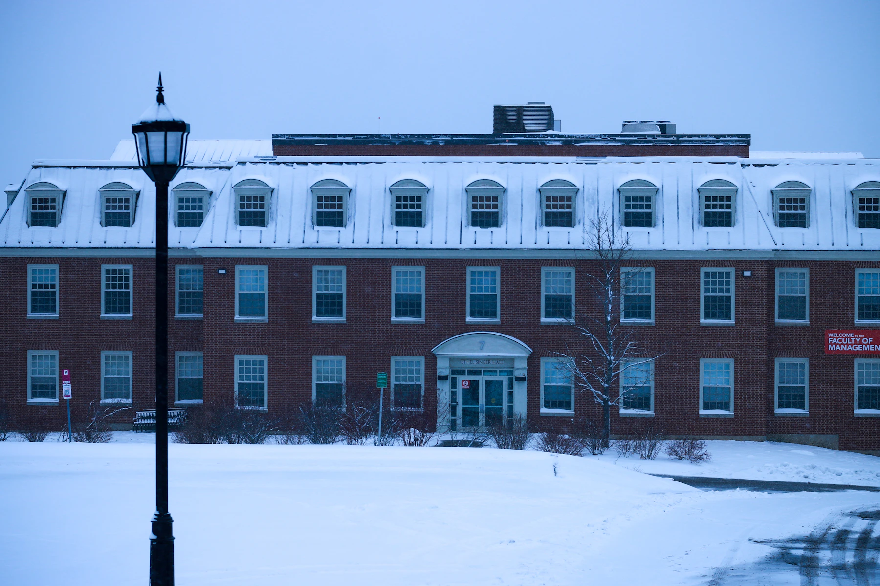 Snow-covered rooftops of a brick building in Fredericton, New Brunswick