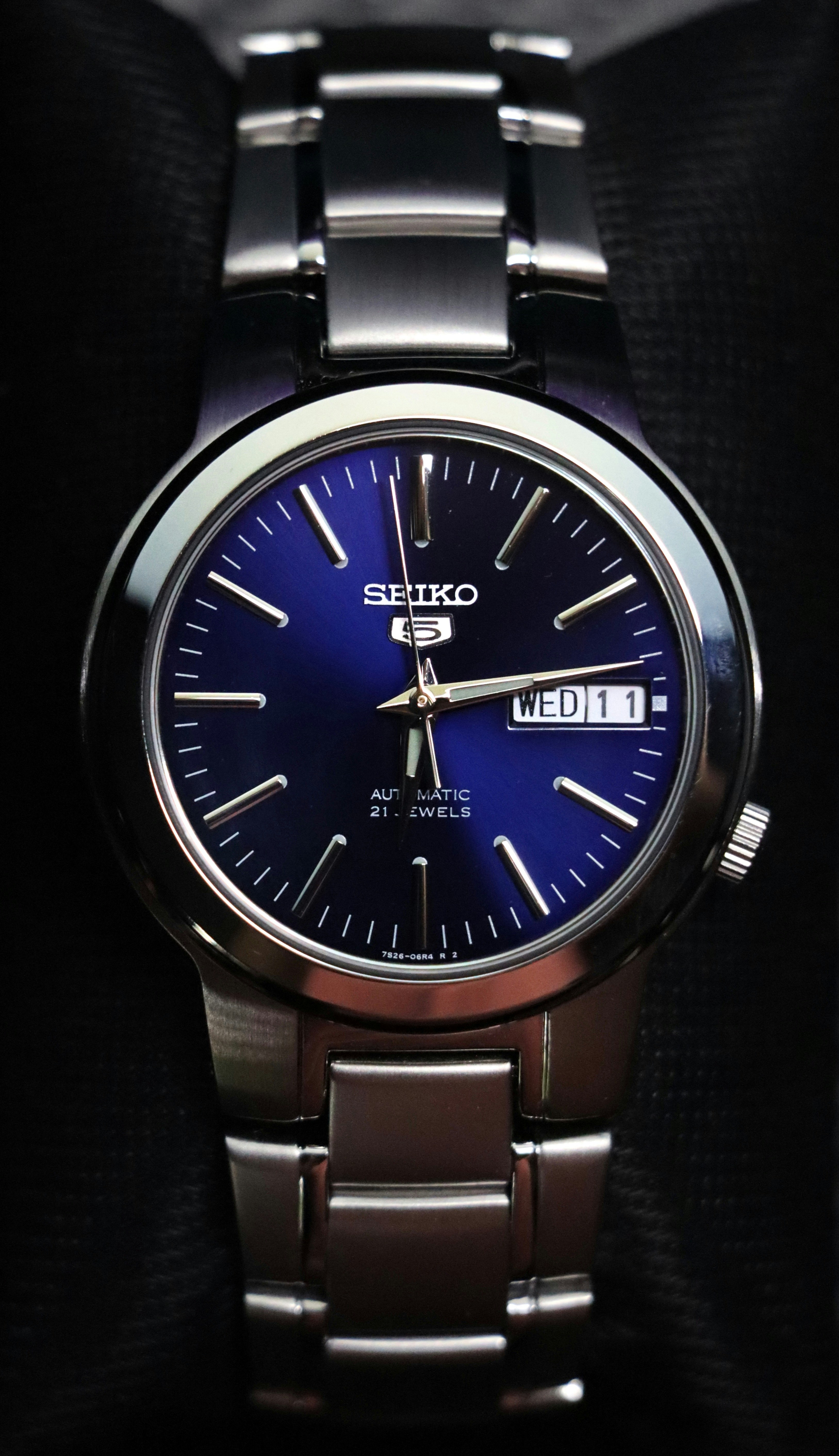 A close up of a watch in a box