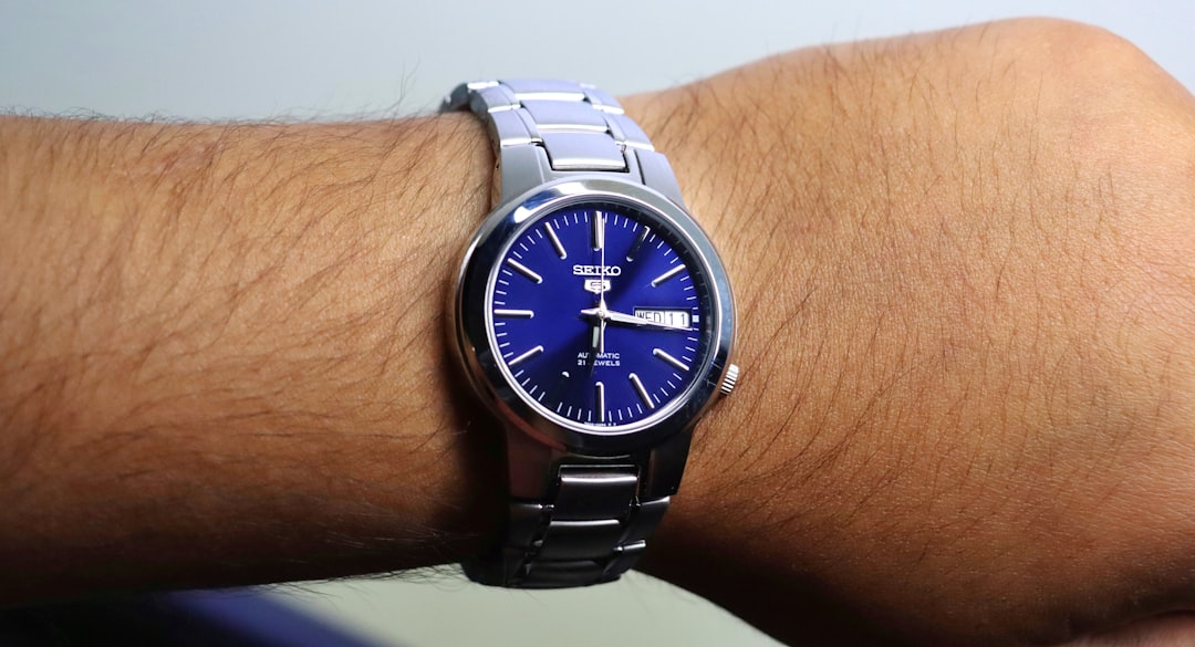 A close up of a person wearing a watch,