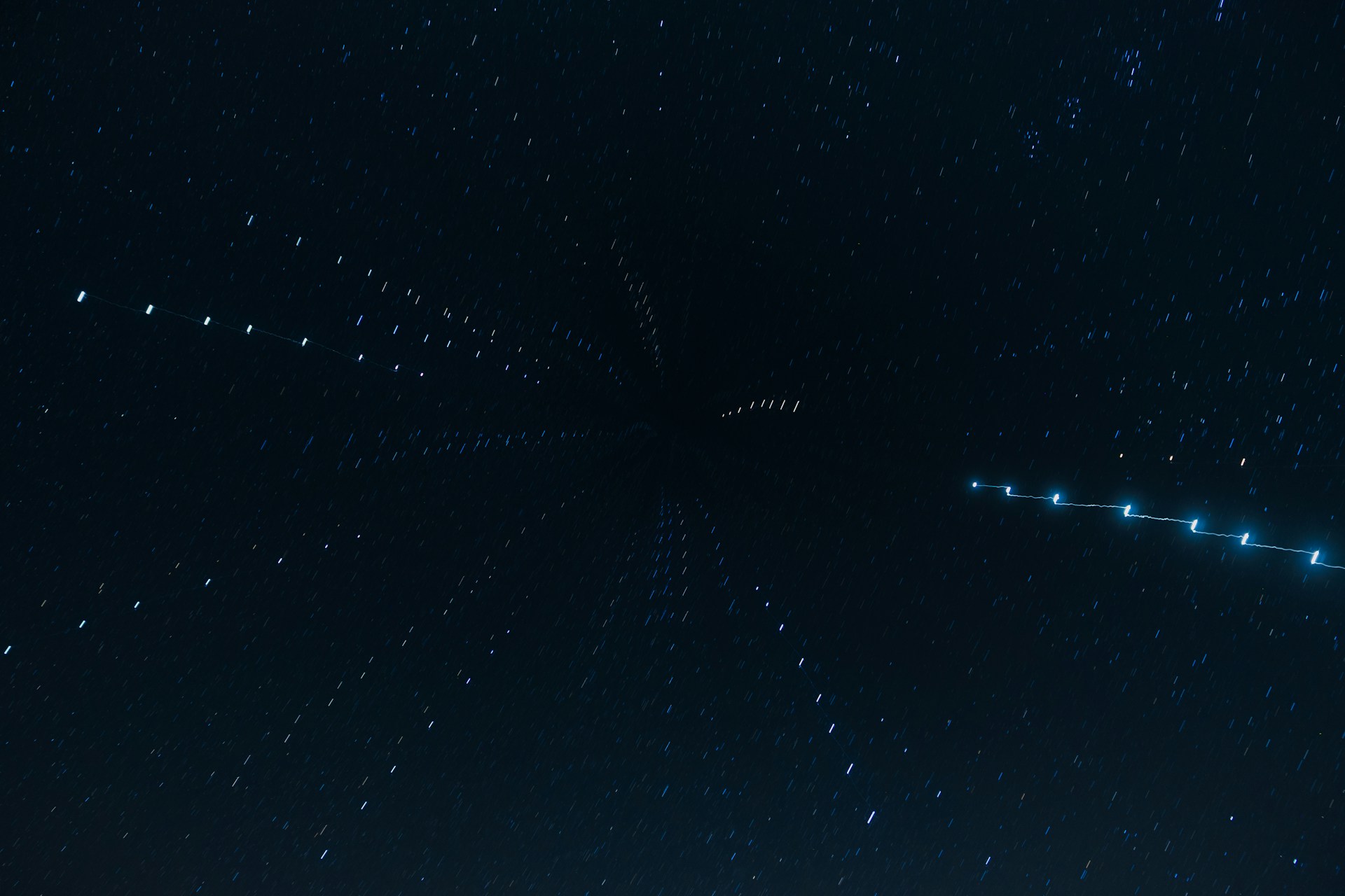 A very large star in the middle of a night sky