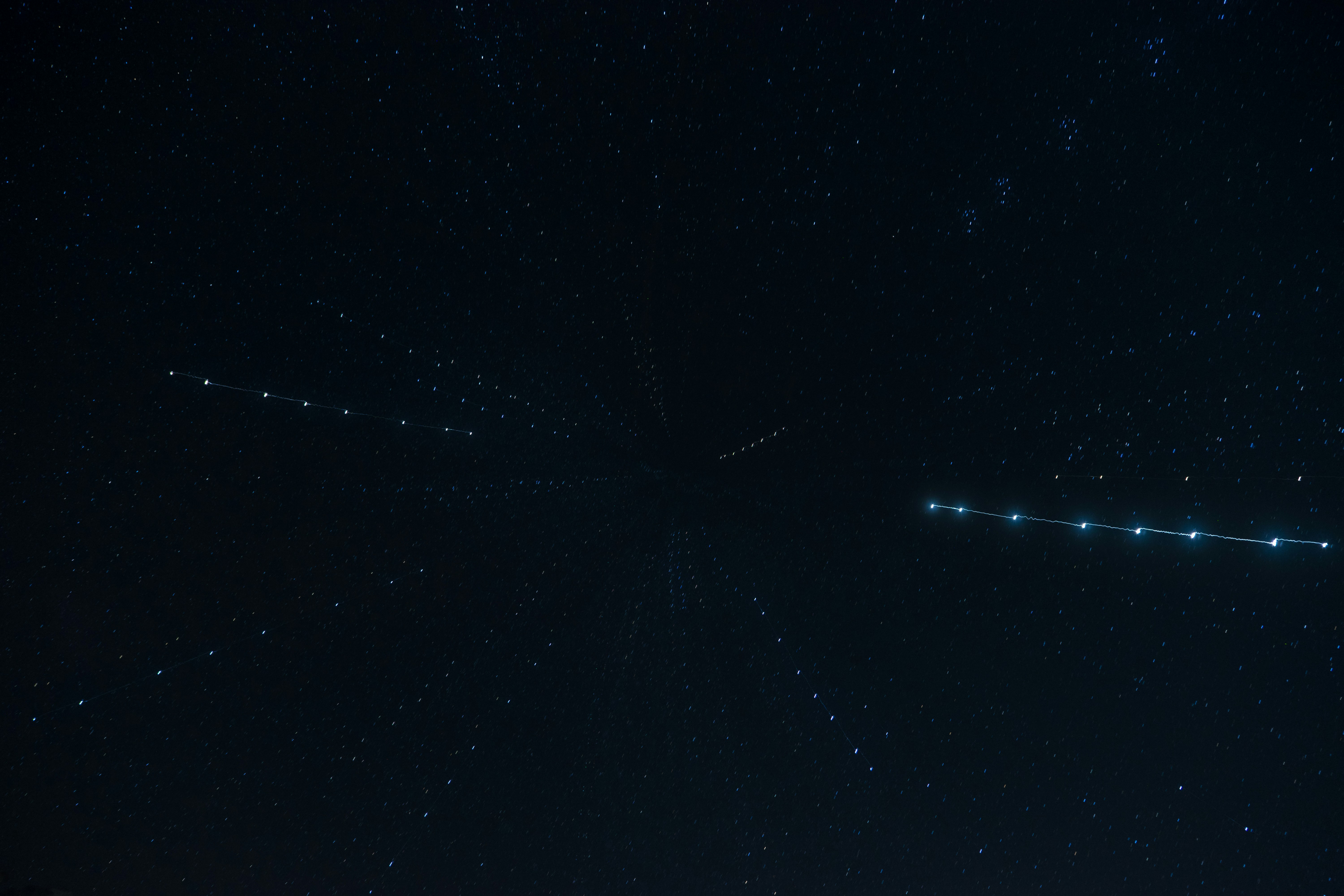 A night view of a city with a clock tower