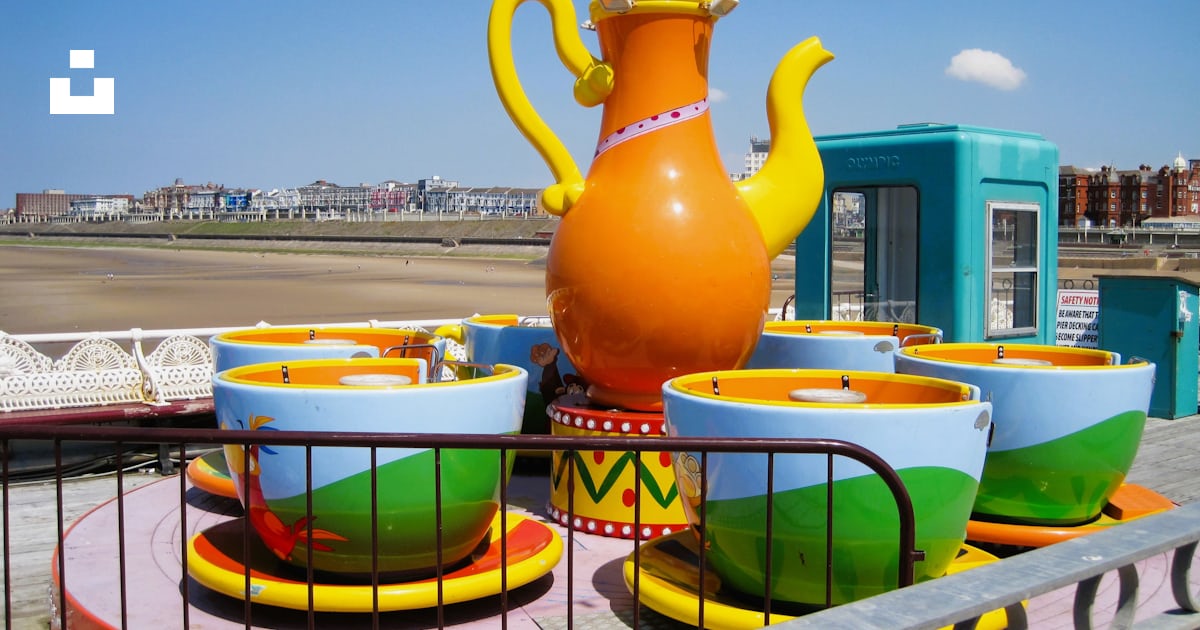 A colorful set of teapots and cups on a carnival ride photo – Free ...