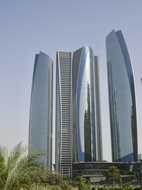 A couple of tall buildings sitting next to each other