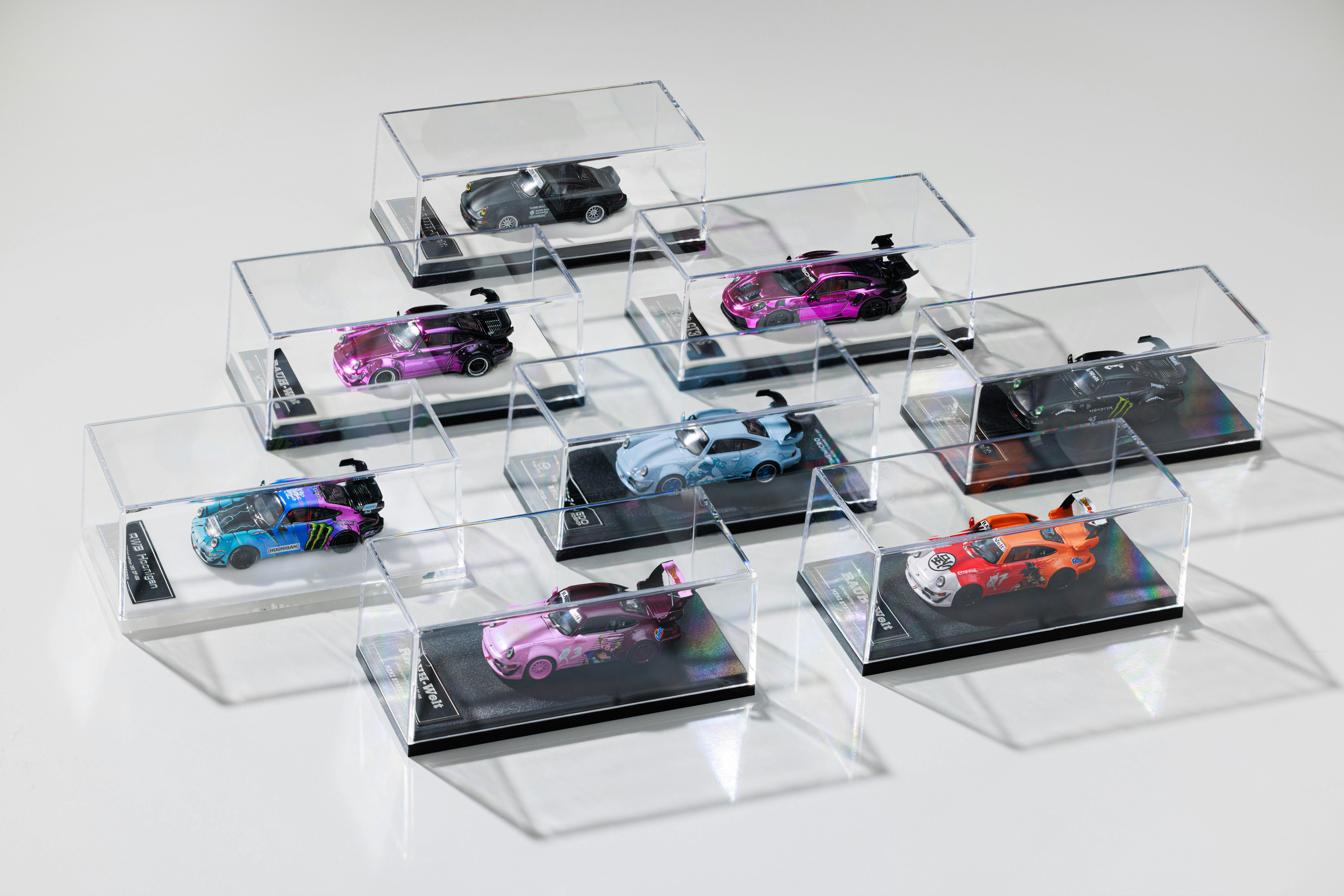 A bunch of cars that are in a display case