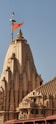 A tall building with a cross on top of it
