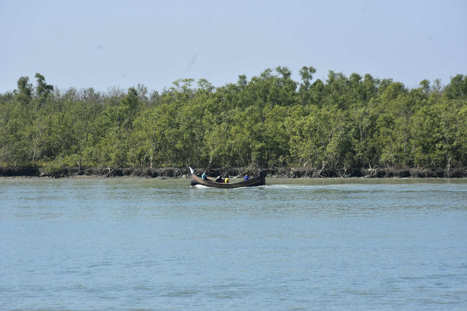 A small boat in a large body of water