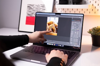 A person sitting in front of a laptop computer