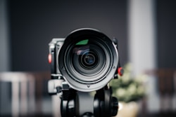 A close up of a camera on a tripod