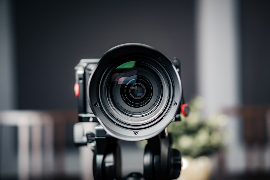 Close-up of a video camera set up and ready to record branded DTC content for Meta ads